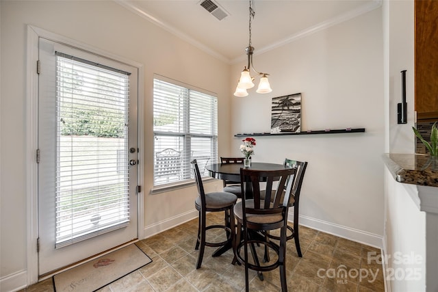 dining area with ornamental molding