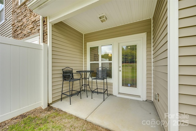 view of exterior entry featuring a patio