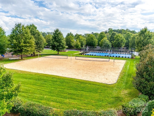 view of community featuring a yard and volleyball court