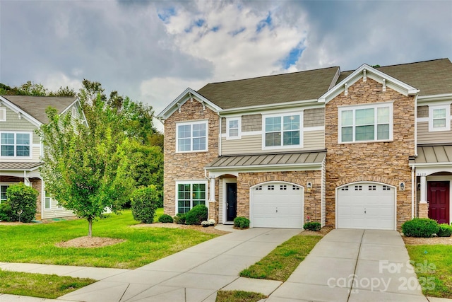 view of front of property featuring a garage and a front lawn