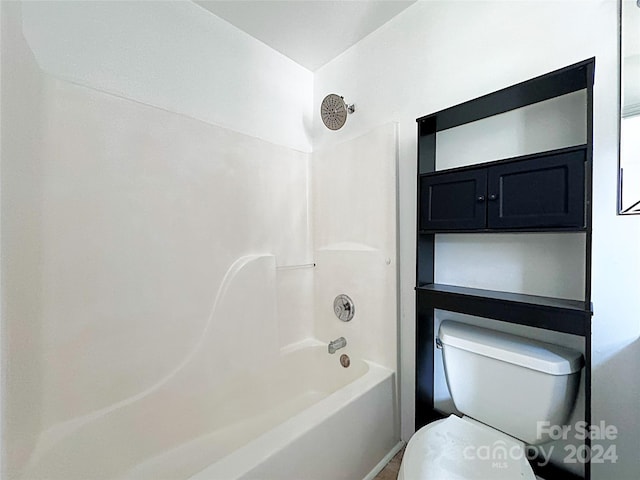 bathroom with toilet and shower / washtub combination