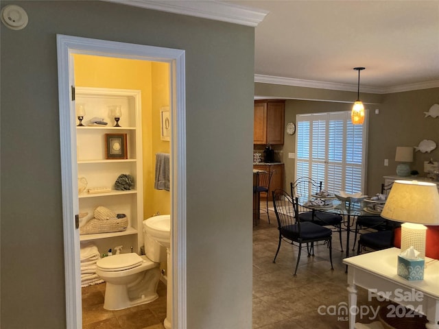 interior space featuring built in features and crown molding