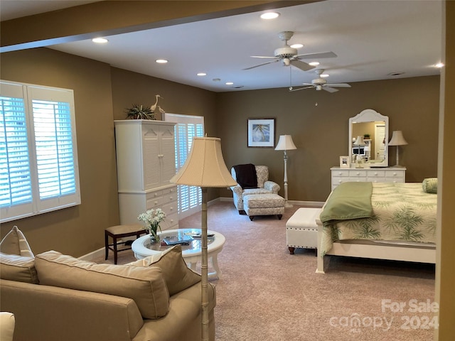 carpeted living room featuring ceiling fan