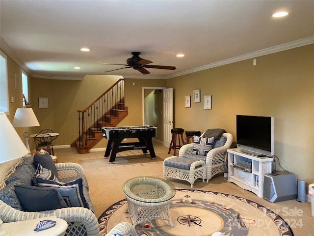 carpeted living room with ceiling fan and crown molding