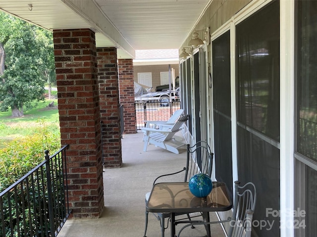 view of patio featuring a porch