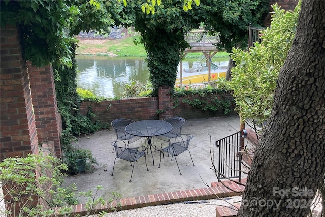 view of patio / terrace featuring a water view