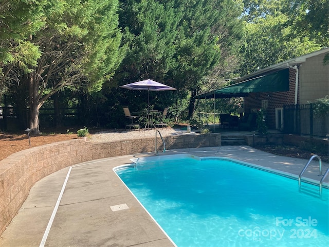 view of pool with a patio area