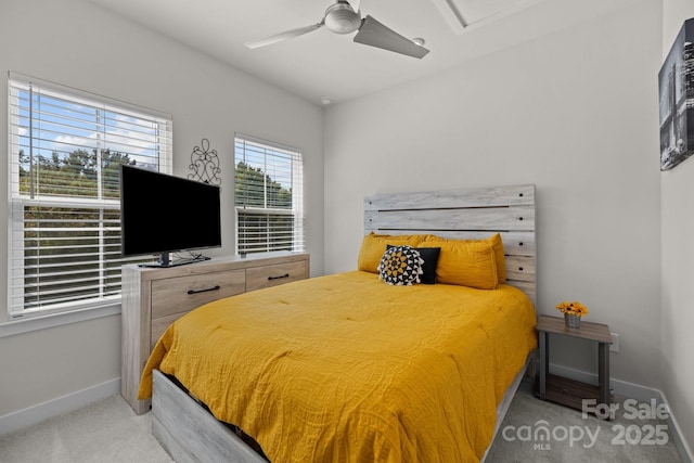 bedroom featuring ceiling fan and light carpet