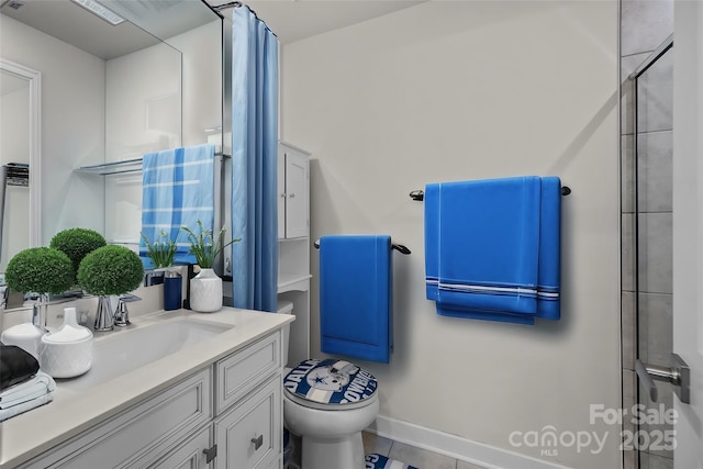 bathroom featuring an enclosed shower, vanity, and toilet