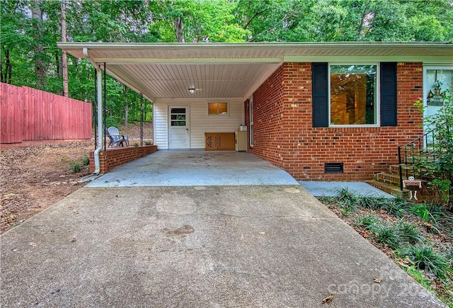 view of vehicle parking with a carport