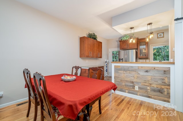 dining space featuring light hardwood / wood-style floors