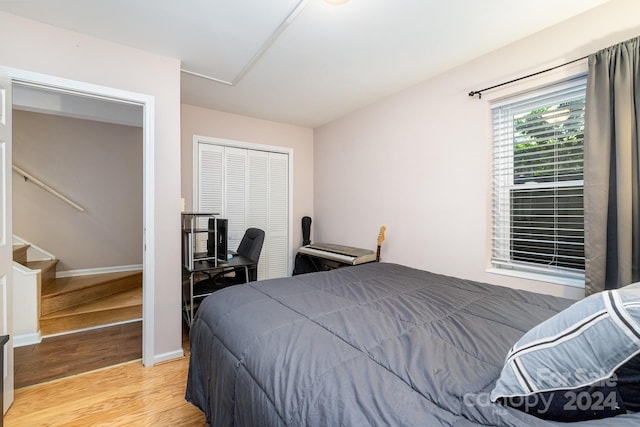 bedroom featuring light hardwood / wood-style floors and a closet