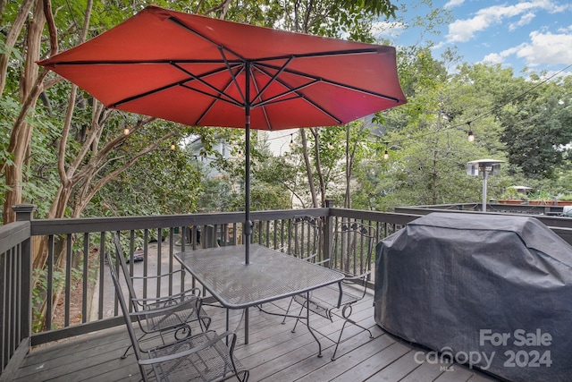 wooden deck with grilling area