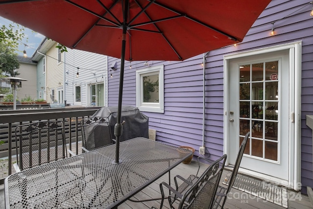 wooden terrace featuring grilling area