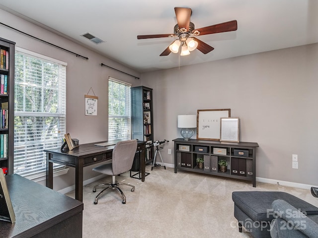 office area with light colored carpet and ceiling fan