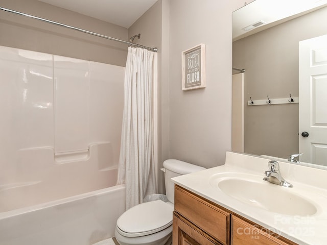 full bathroom with shower / bath combination with curtain, vanity, and toilet