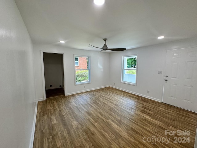 spare room with ceiling fan and hardwood / wood-style floors