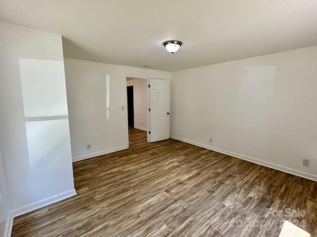 spare room featuring hardwood / wood-style floors