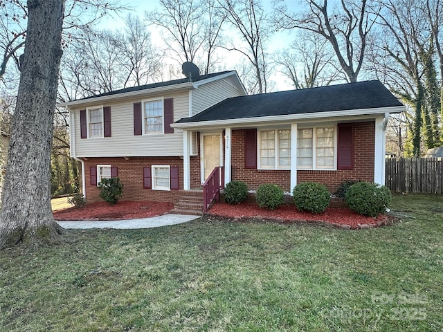 tri-level home with a front yard