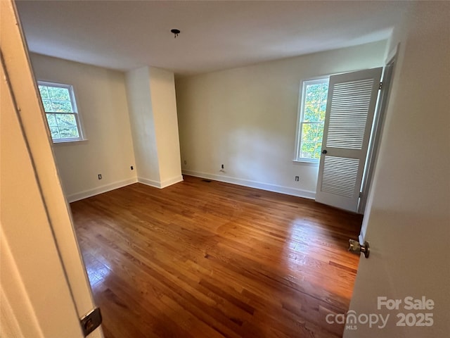 spare room featuring hardwood / wood-style flooring