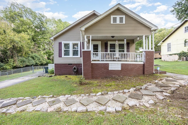 bungalow featuring a front yard and a porch