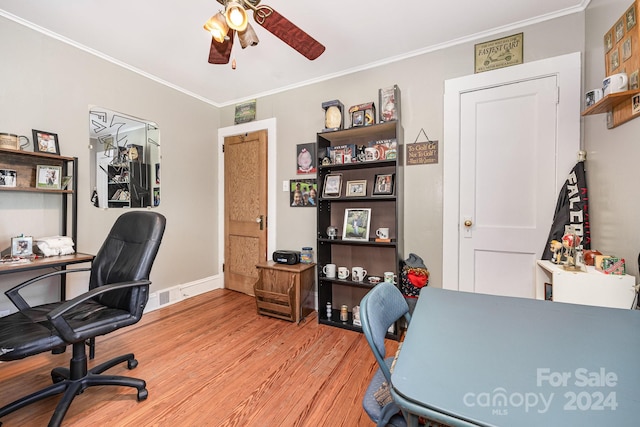 office featuring ceiling fan, light hardwood / wood-style flooring, and ornamental molding