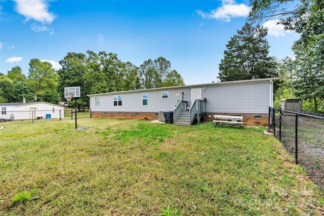 7686 Hickory Creek Dr, Denver, NC 28037 - rear view of house featuring a lawn, fence, and crawl space