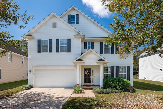 view of front of house with a front lawn and a garage