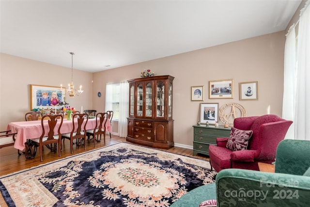 interior space with a notable chandelier and hardwood / wood-style flooring