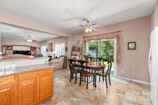 dining room featuring ceiling fan