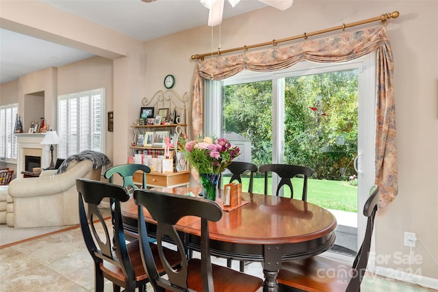 dining space featuring ceiling fan and a wealth of natural light