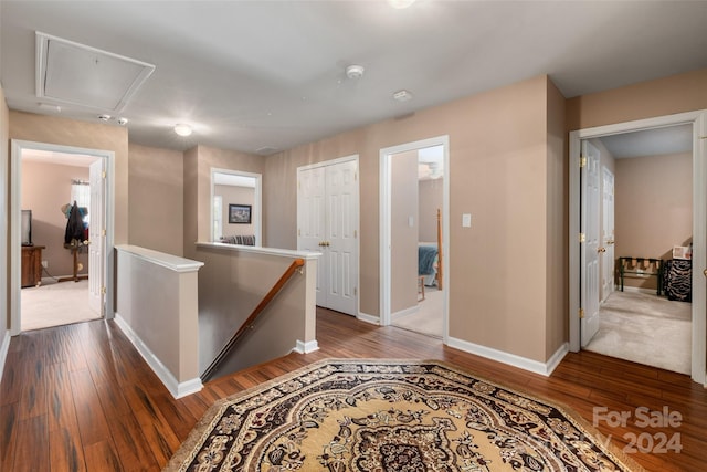 hall with hardwood / wood-style flooring