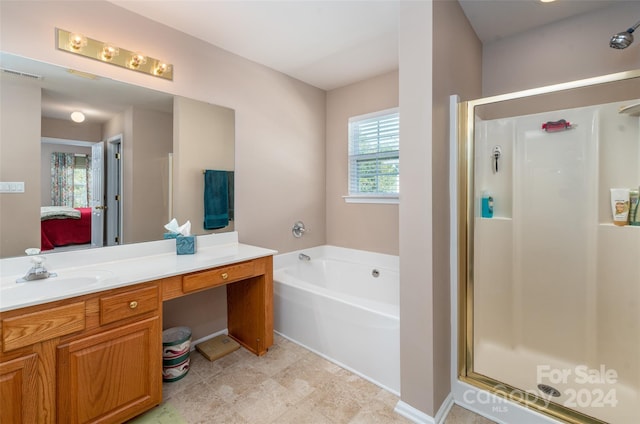 bathroom featuring independent shower and bath and vanity