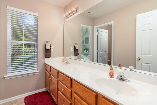 bathroom with vanity and tile patterned floors