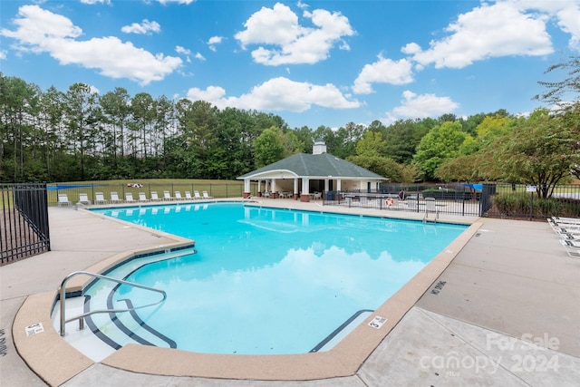 view of pool featuring a gazebo and a patio area