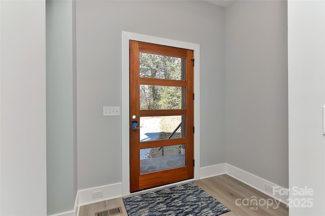 foyer entrance featuring hardwood / wood-style floors