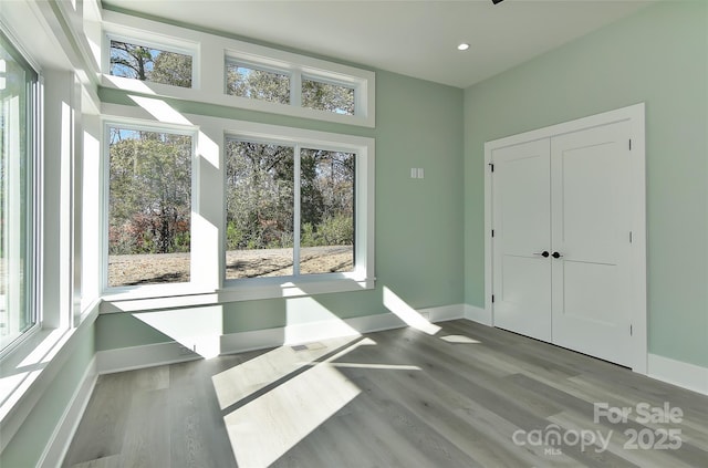 unfurnished sunroom featuring plenty of natural light