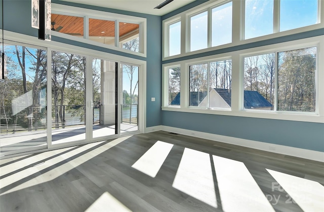 empty room with dark wood-type flooring