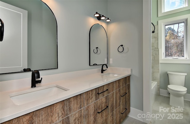 full bathroom featuring toilet, shower / bathing tub combination, tile patterned floors, and vanity