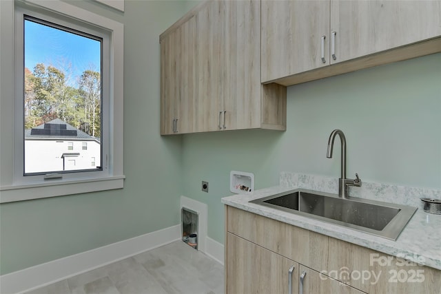 laundry room featuring a wealth of natural light, cabinets, sink, washer hookup, and hookup for an electric dryer