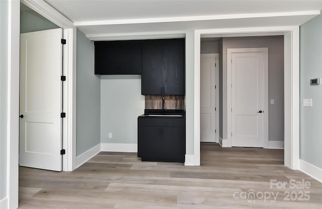 kitchen with light hardwood / wood-style floors and sink