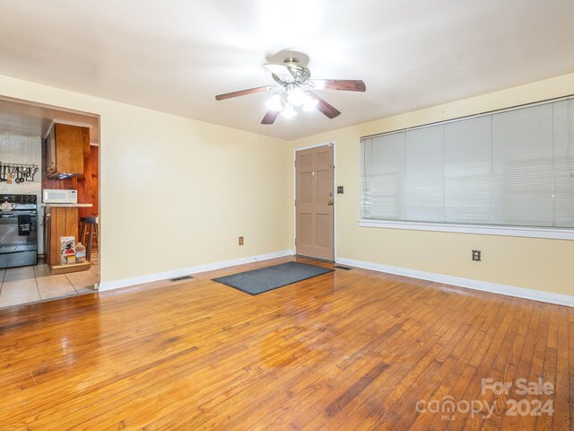 interior space featuring light wood-type flooring and ceiling fan