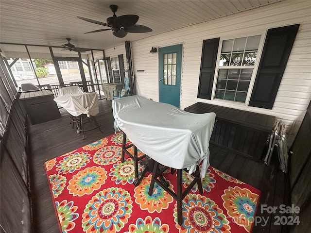 deck with ceiling fan and covered porch