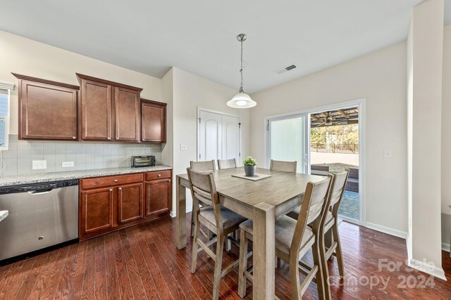 dining space with dark hardwood / wood-style floors