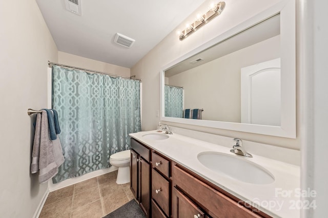 bathroom with walk in shower, vanity, and toilet