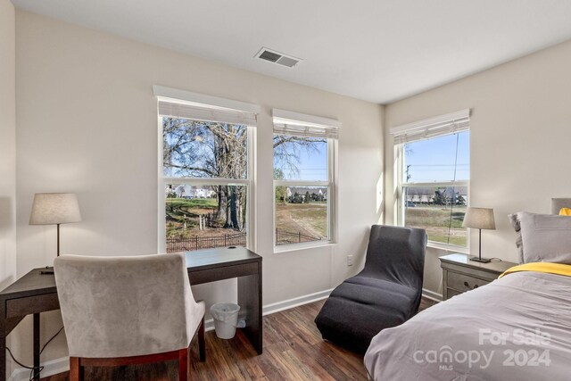 bedroom featuring dark hardwood / wood-style flooring