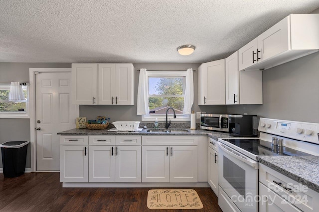 kitchen featuring white cabinets, sink, a textured ceiling, dark wood-type flooring, and white electric stove