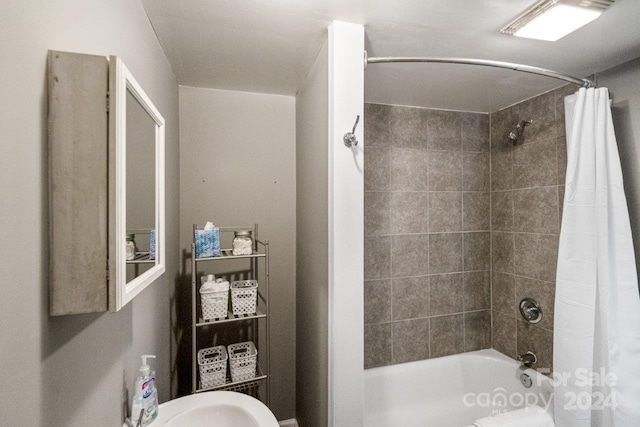 bathroom with shower / bathtub combination with curtain