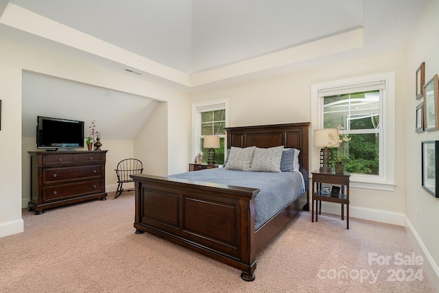 carpeted bedroom featuring lofted ceiling