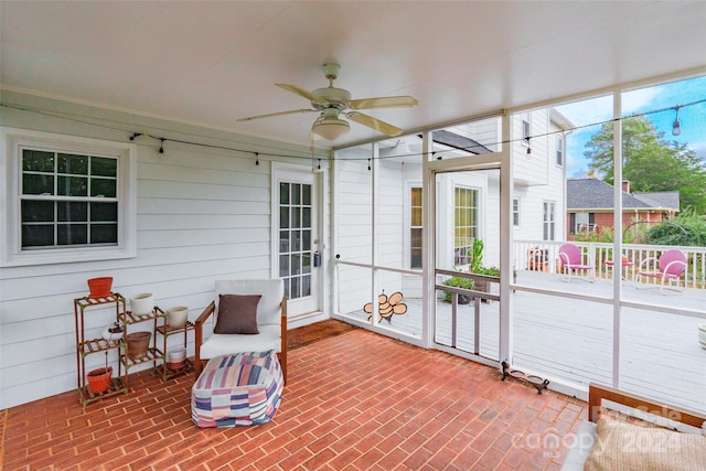 sunroom / solarium with ceiling fan